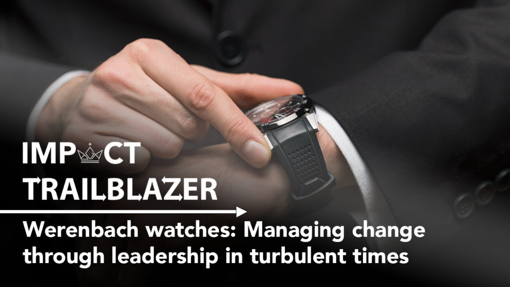 An Impact Trailblazer research banner with a business professional looking at a watch. This is from the research paper, 'Werenbach watches: Managing change through leadership in turbulent times'.