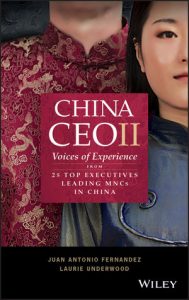 Front cover of Chine CEOII. This is a red and black book with two individuals of Chinese ethnicity, both wearing traditional Chinese outfits. This book states 'China CEOII; voices from experience from 25 top executives leading MNCs in China' by Authors Juan Antonio Fernandez and Laurie Underwood.