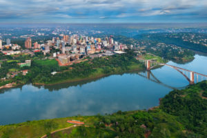 Aerial view of the Paraguayan city of Ciudad del Este and Friendship Bridge, connecting Paraguay and Brazil through the border over the Parana River