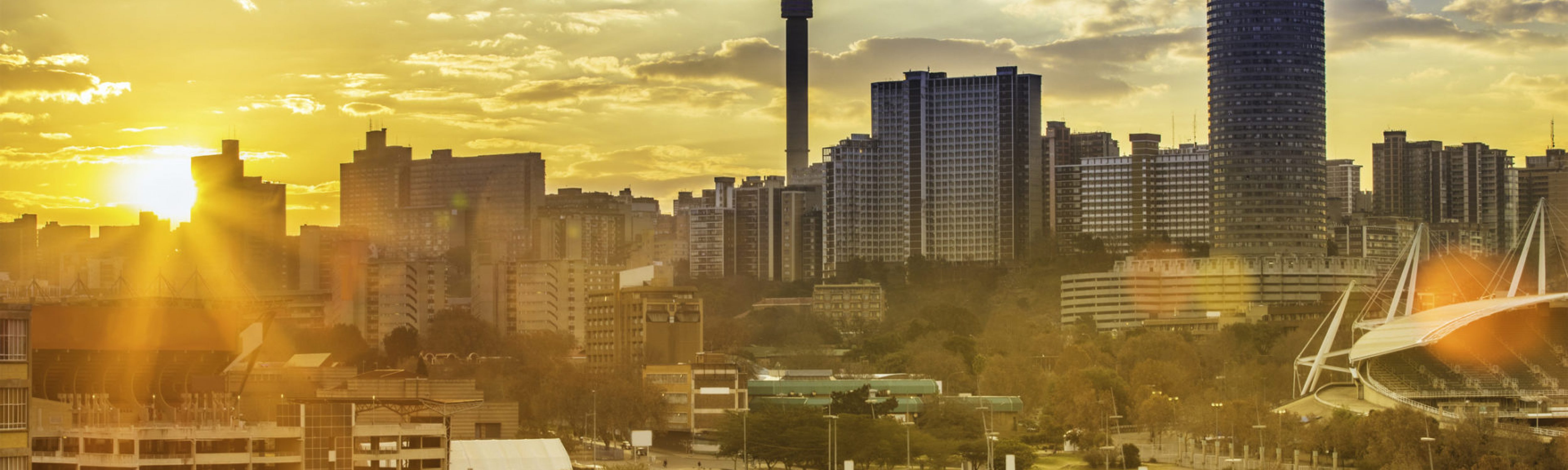 Johannesburg cityscape, taken at sunset, showing Hillbrow residential centre with the prominent Ponte flats and the communications tower. Image for the African and Middle Eastern Capacity Building Workshop series.